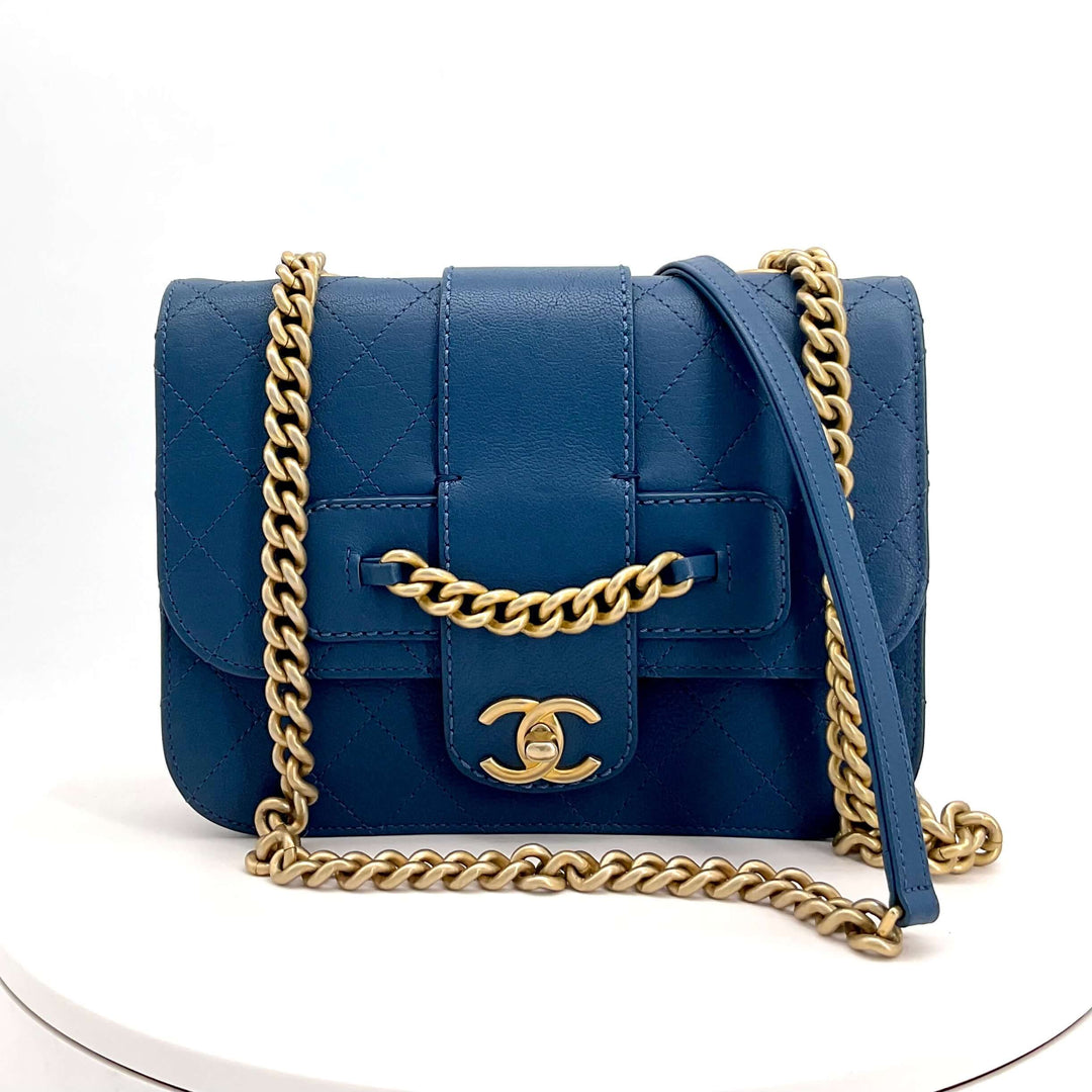 Chanel Mini Chain Front Classic Single Flap Bag In Blue|LuxLoveLouis | Embrace timeless elegance with the Chanel Mini Chain Front Classic Single Flap Bag in blue. Crafted from luxurious calfskin leather and accented with brushed gold hardware, this exquis