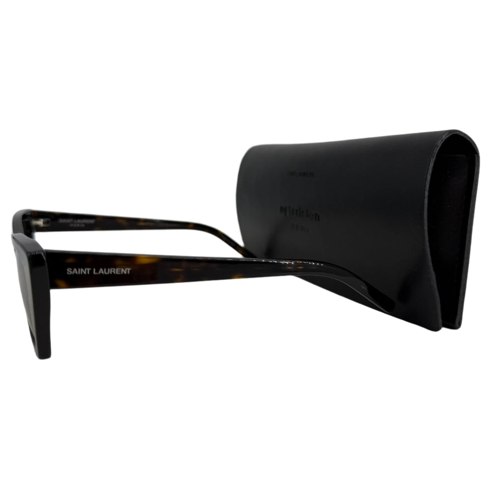 Saint Laurent cat eye frame sunglasses with tortoiseshell pattern, displayed beside a sleek black case.