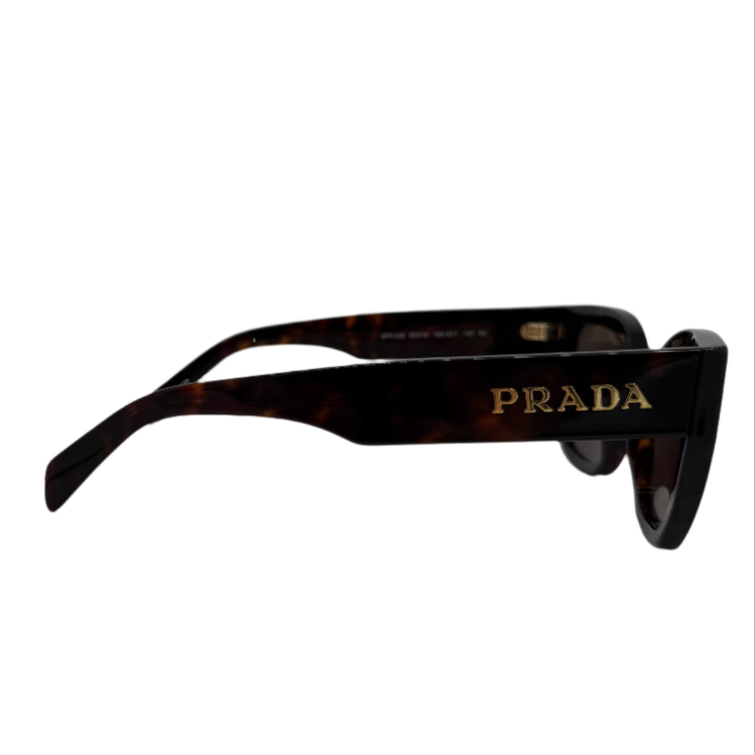 Side view of Prada sunglasses with logo in briarwood tortoiseshell acetate, showcasing sophisticated design.