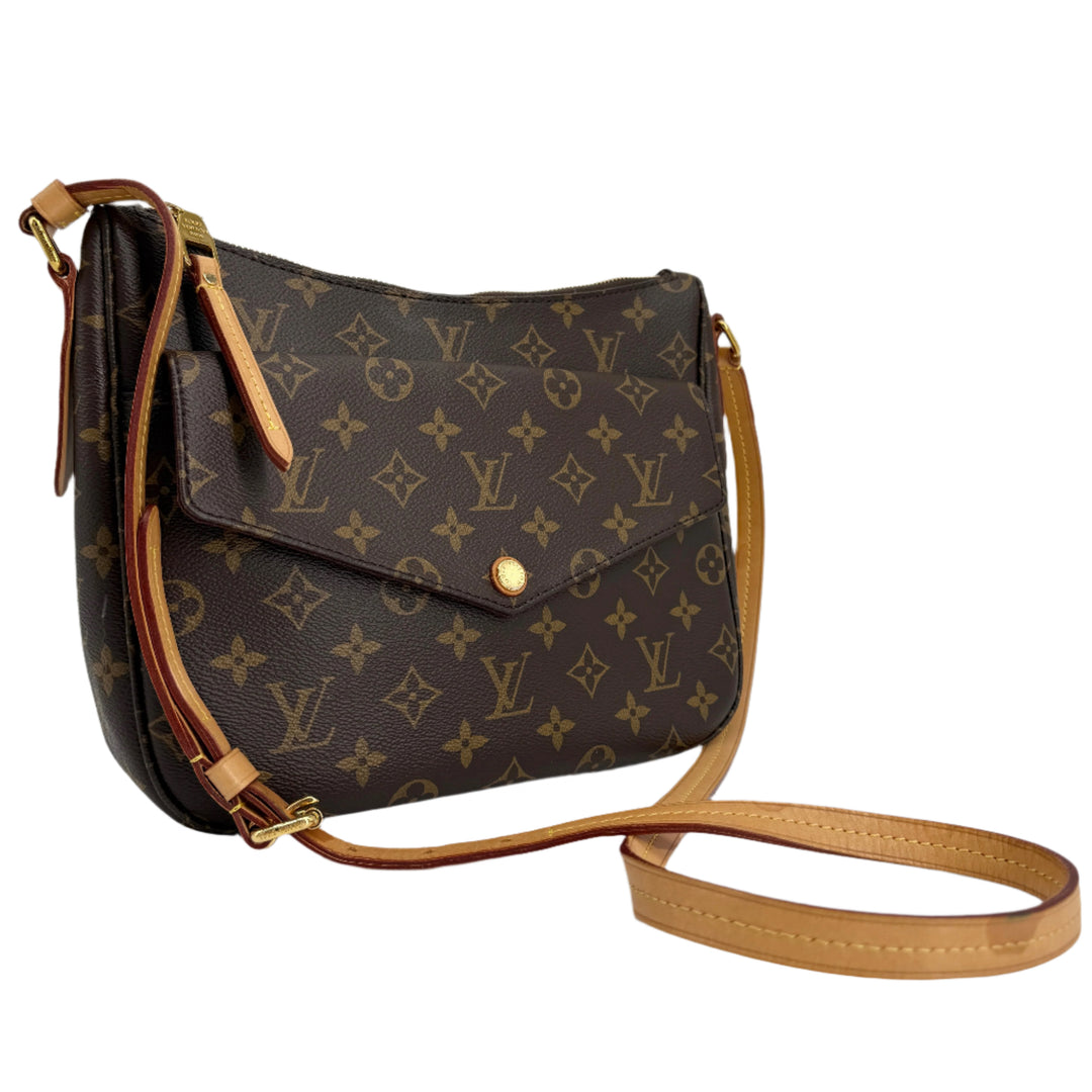 Louis Vuitton Monogram Mabillon Shoulder Bag featuring iconic monogram canvas, polished brass hardware, and an adjustable strap.