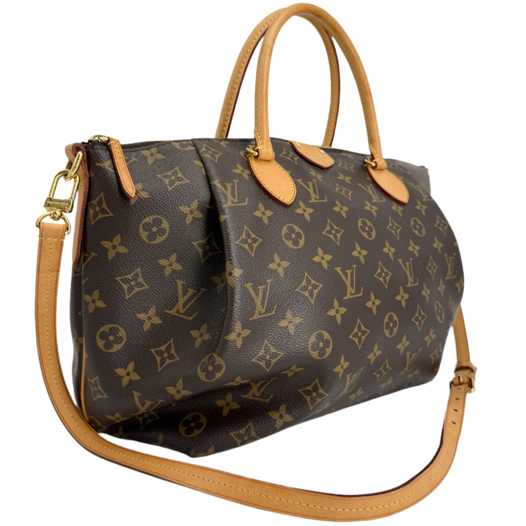 Louis Vuitton Monogram Turenne MM handbag with top handles and crossbody strap, showcasing signature style and elegance.