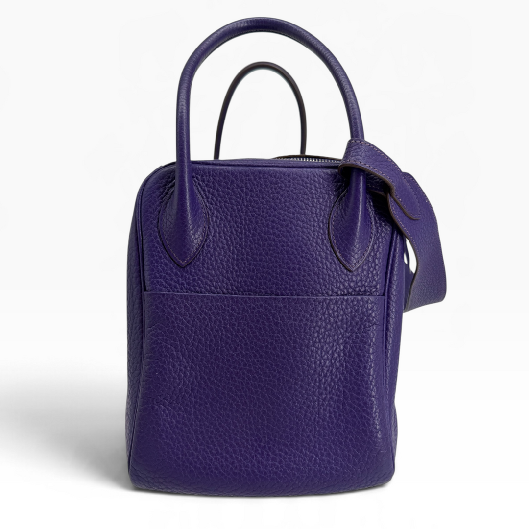 Hermès Lindy 26 Iris Clemence leather side profile showing exterior slip pocket and rolled handle attachments
