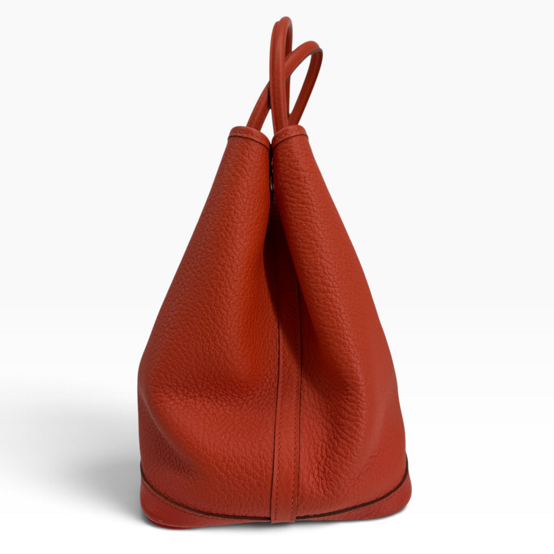 Hermès Garden Party 30 Orange Poppy side profile with expandable Negonda leather panels