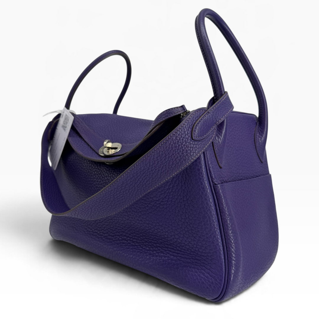 Hermès Lindy 26 Iris Clemence leather front three-quarter view showing palladium turn-lock and shoulder strap