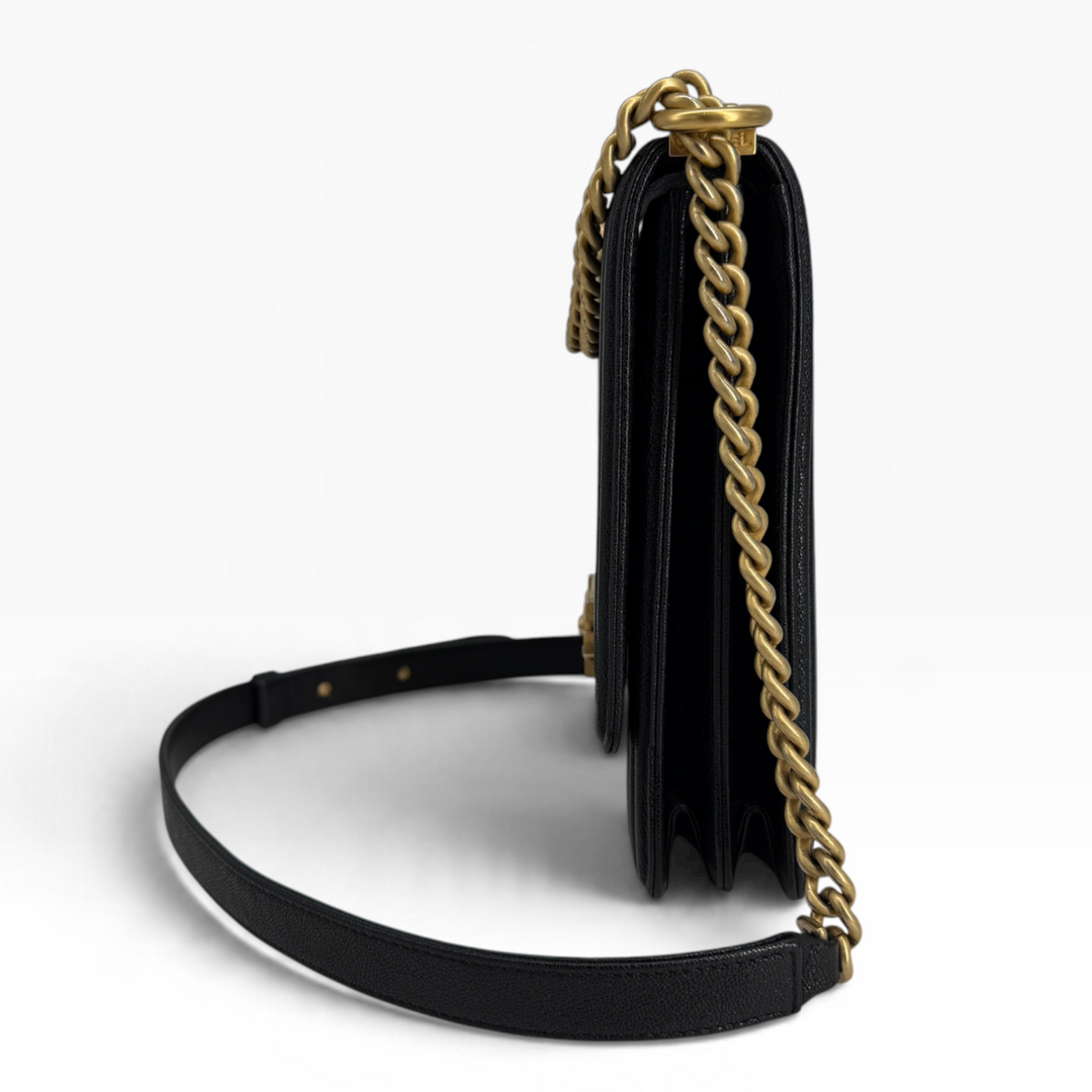 Chanel North South Boy Bag side profile showing layered leather gussets and aged gold chain strap