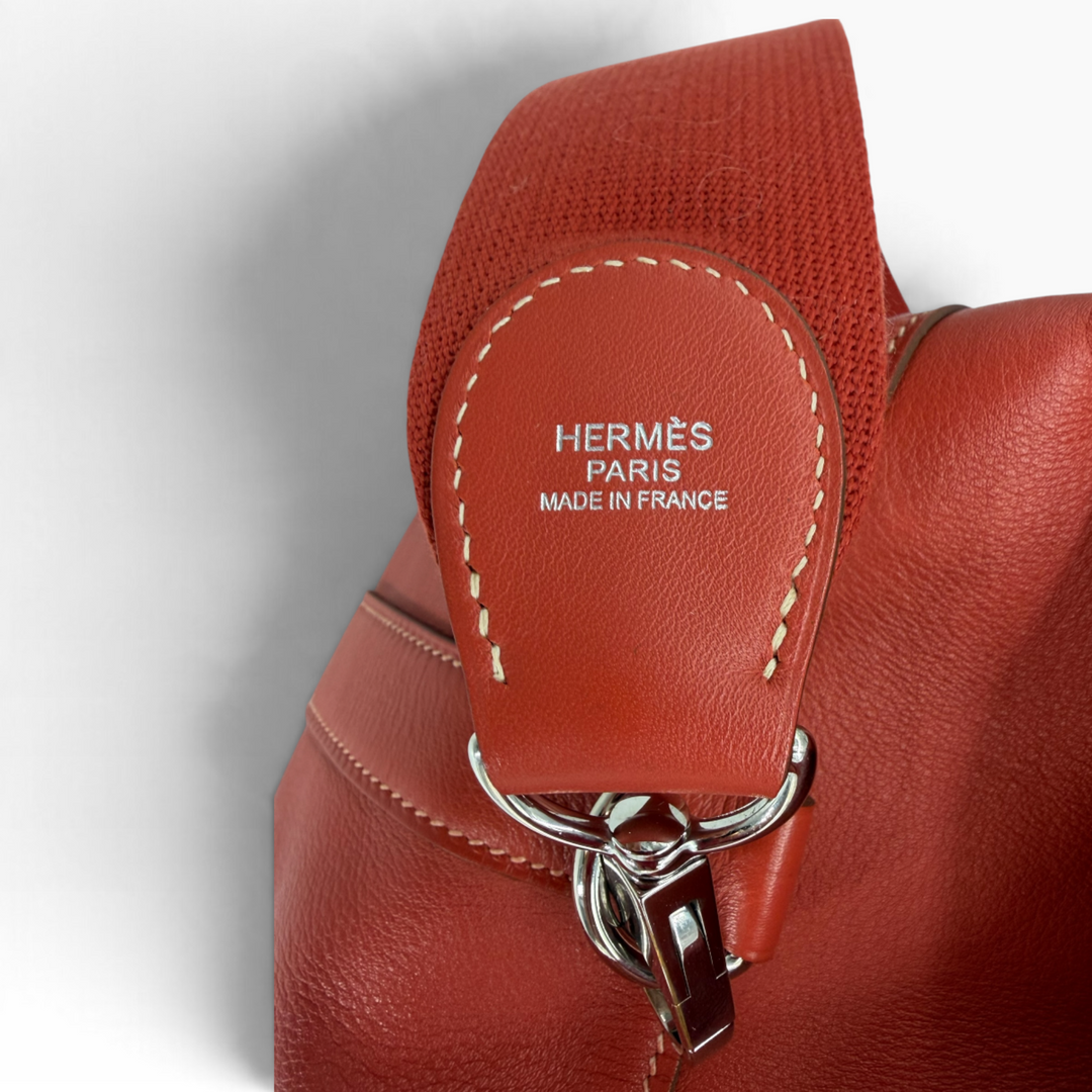 Close-up of Hermès Paris Made in France marking on the Toolbox 26 Capucine leather-trimmed textile strap