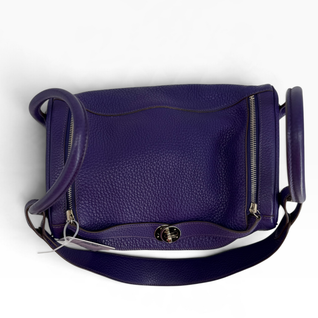 Hermès Lindy 26 Iris purple Clemence leather top view showing dual zipper closures, turn-lock flap and handles