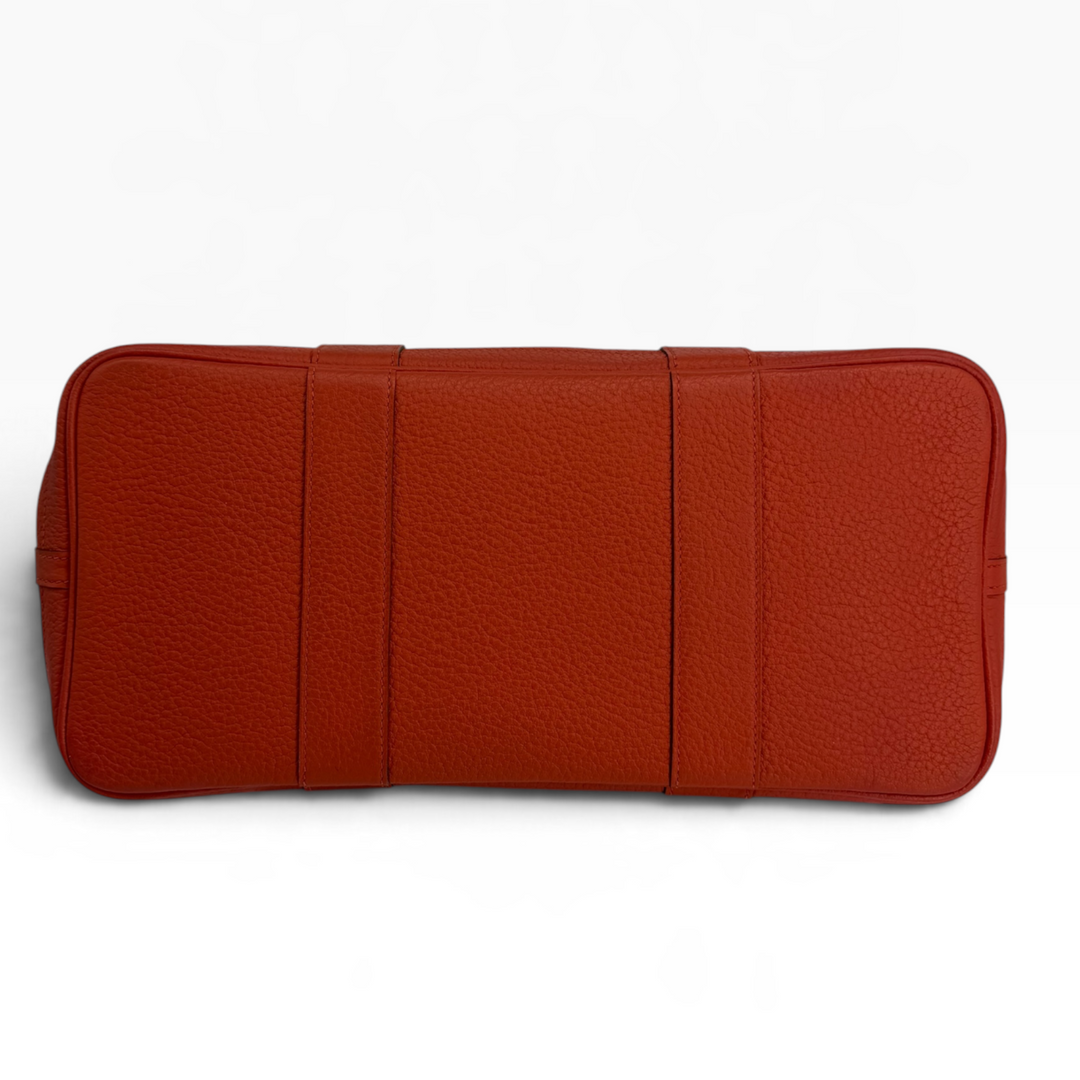 Hermès Garden Party 30 Orange Poppy leather bottom showing rectangular base and leather reinforcement strips
