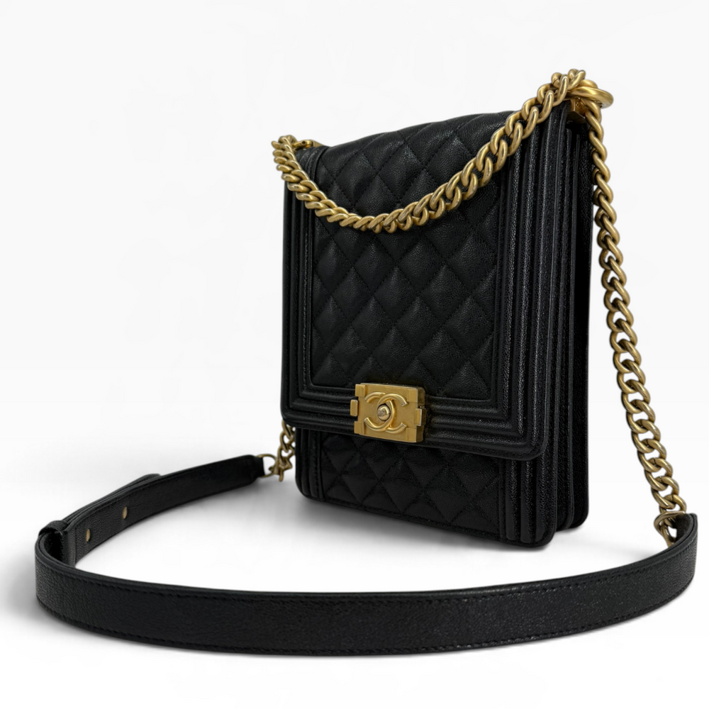 Chanel North South Boy Bag front three-quarter view showing diamond quilting, aged gold chain and leather shoulder section