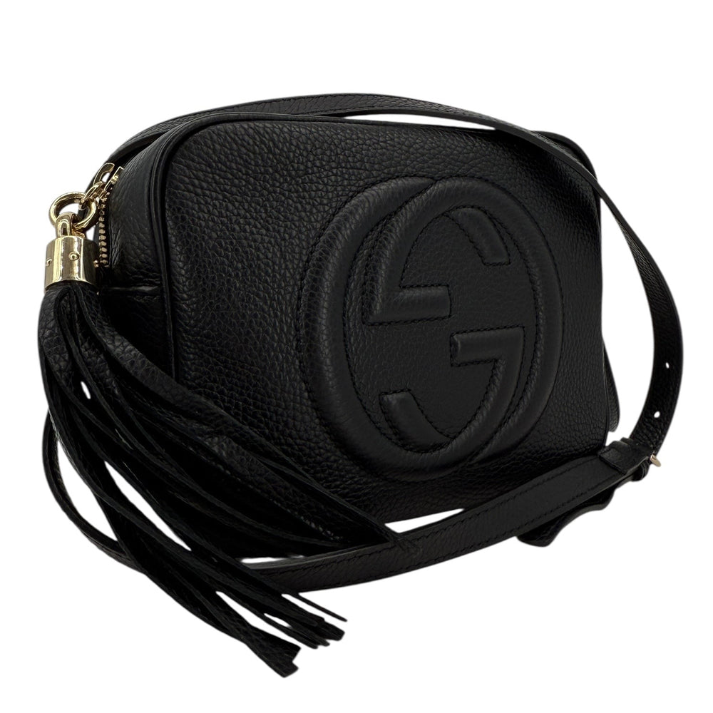 Gucci Soho Disco Small Crossbody in black pebbled calfskin with tassel, featuring signature interlocking G design.