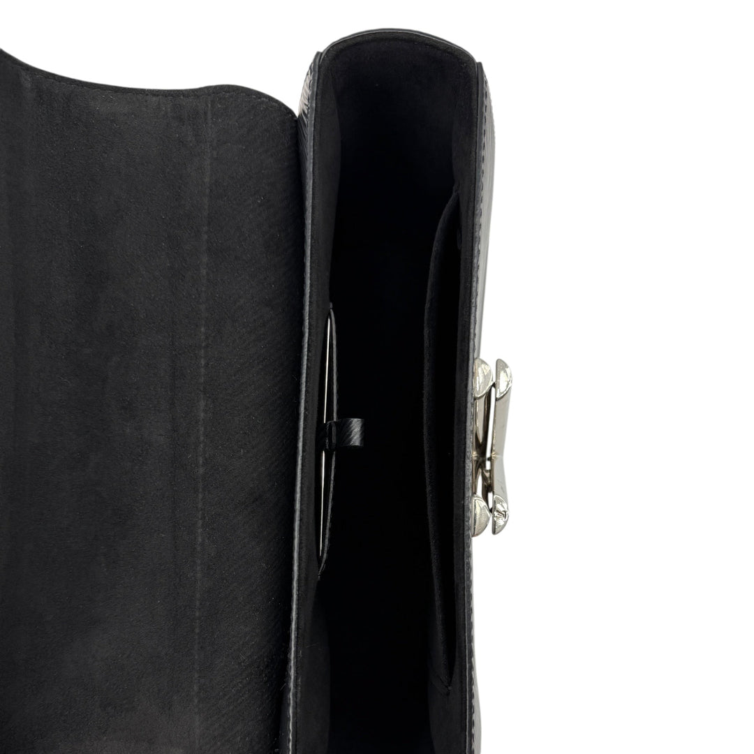 Interior view of Louis Vuitton Epi Twist MM crossbody bag in black, showcasing its elegant design and silver LV twist lock.