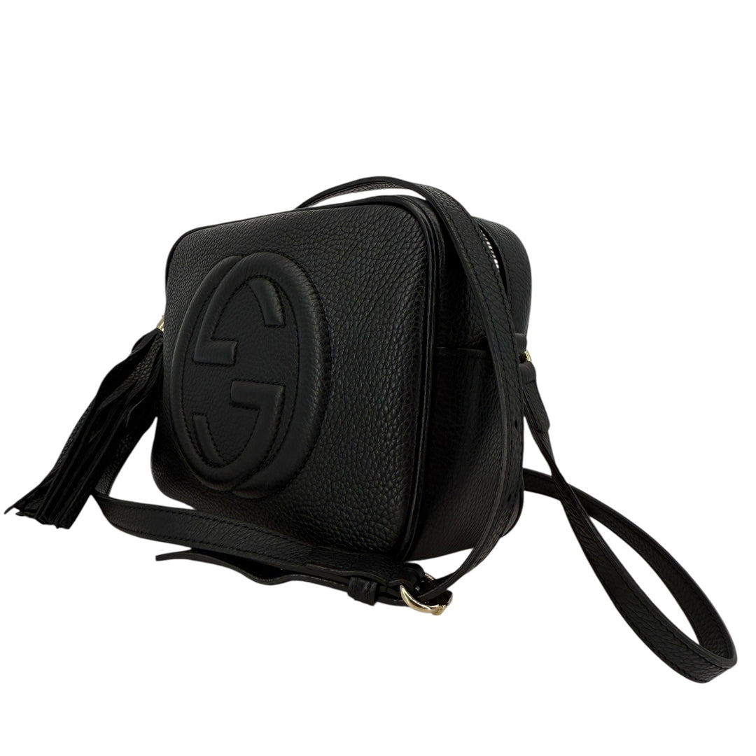 Gucci Soho Disco Small Crossbody bag in black pebbled calfskin with tassel detail and interlocking G logo.