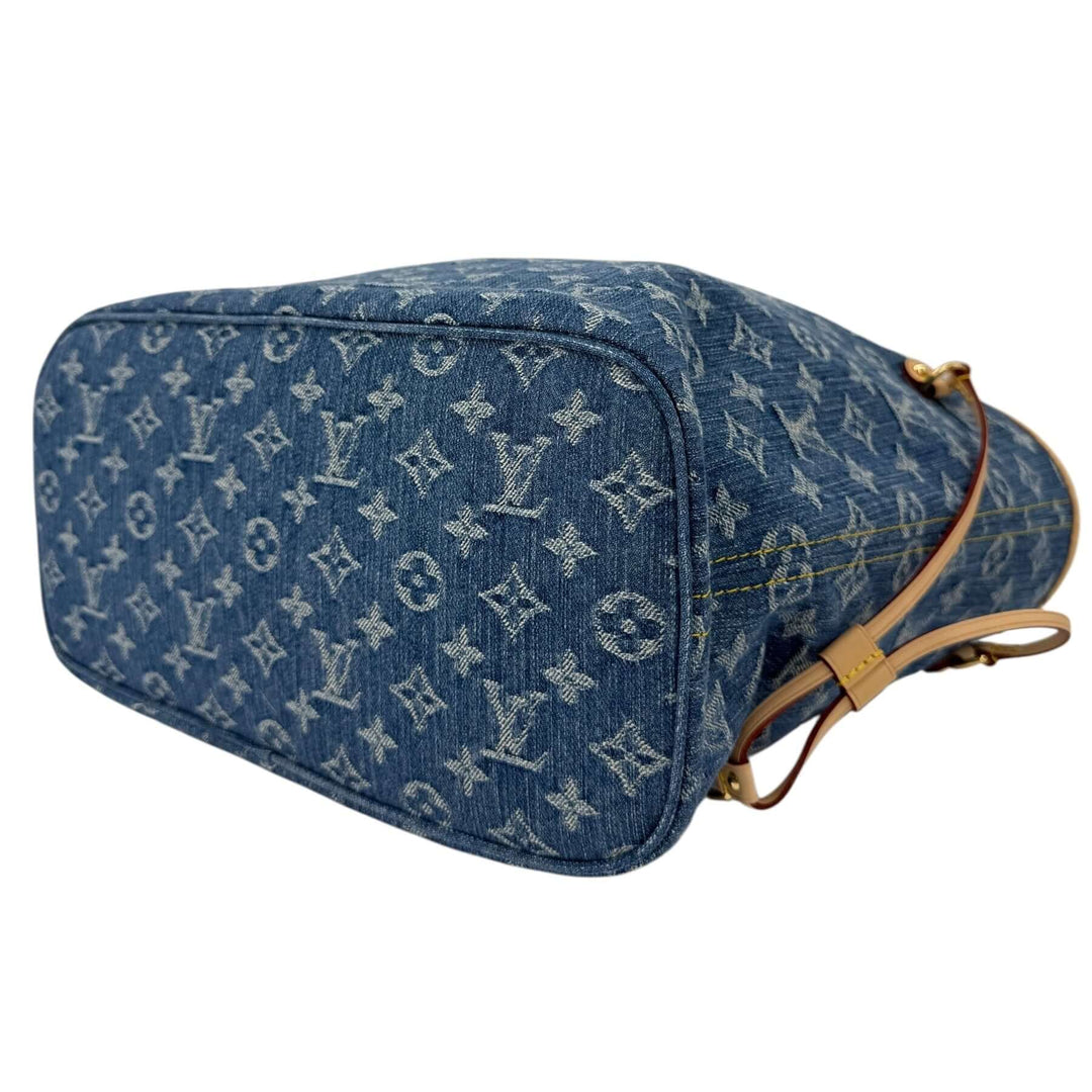 Louis Vuitton Neverfull MM Monogram Denim | LuxLoveLouis bag base with iconic LV pattern and natural cowhide trim.