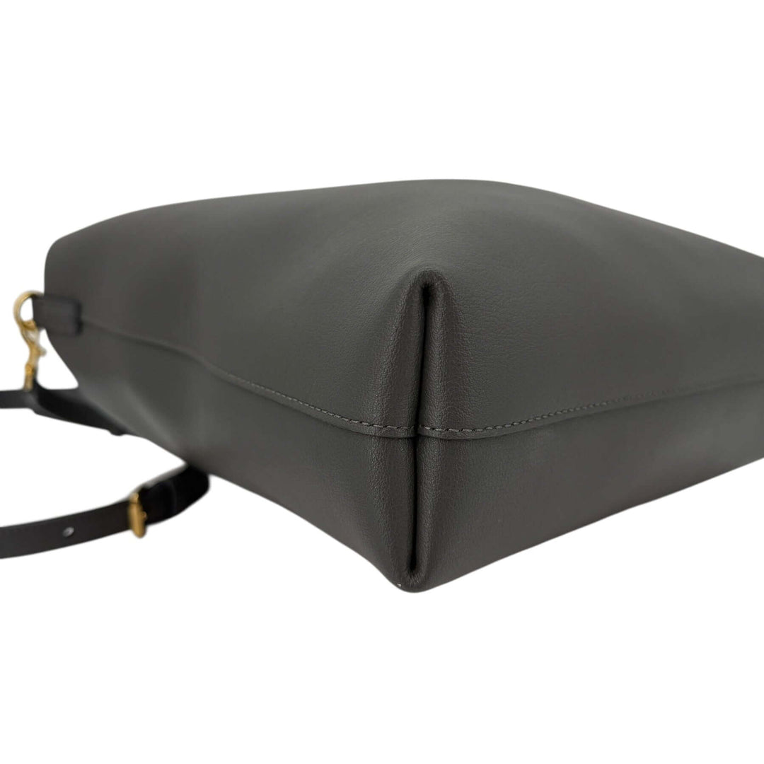 Saint Laurent Toy Shopping Bag in Charcoal Gray Leather | LuxLoveLouis side view showing sleek design and calfskin leather finish.