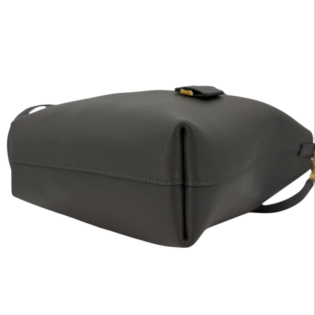 Saint Laurent Toy Shopping Bag in Charcoal Gray Leather | LuxLoveLouis side view showcasing supple calfskin leather texture.