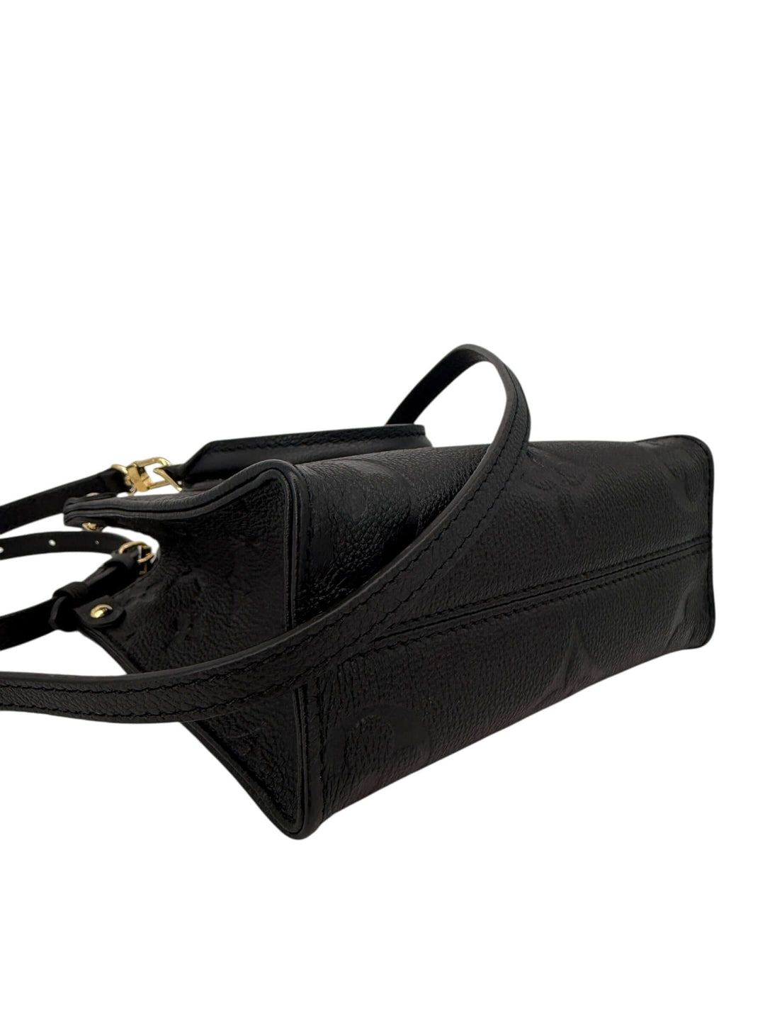 Louis Vuitton OnTheGo BB Monogram Empreinte Black | LuxLoveLouis side view detailing the embossed leather and strap.