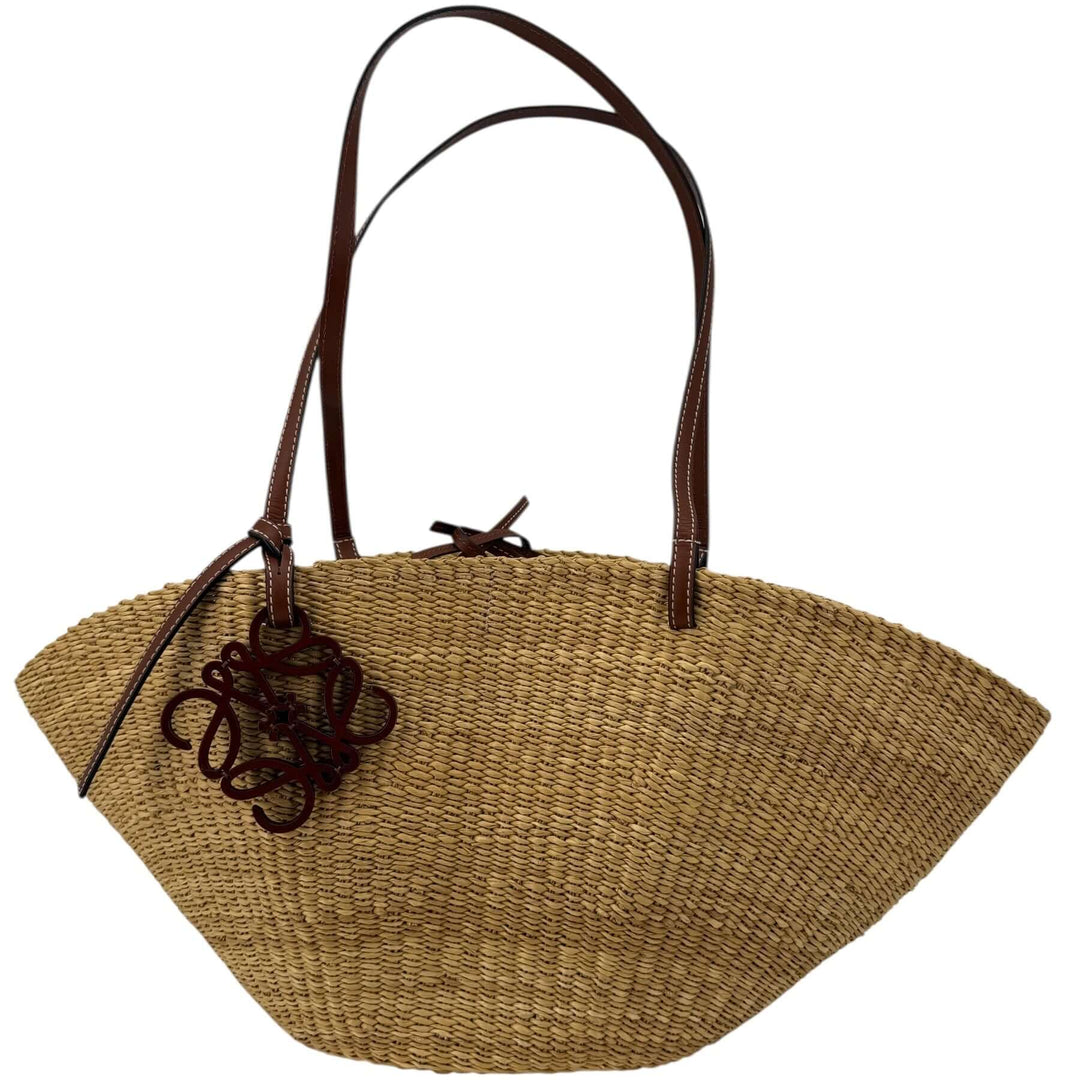 Loewe Raffia Basket Tote in Brown & Natural Tan | LuxLoveLouis exhibiting a natural raffia texture and refined leather accents.