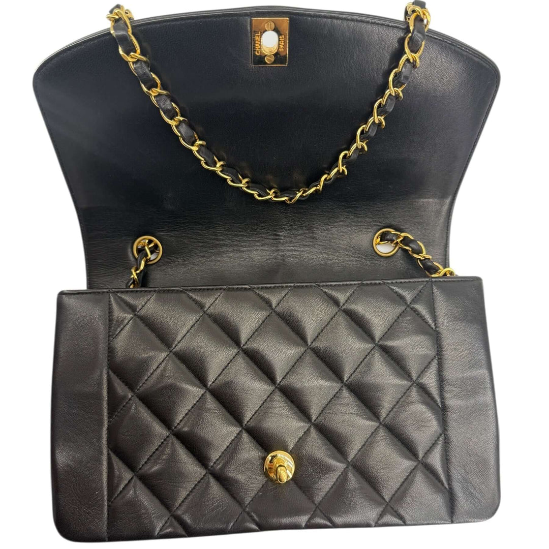 Chanel Diana 22 Small Black Lambskin Shoulder Bag | LuxLoveLouis interior showcasing iconic matelassé design and gold chain details.