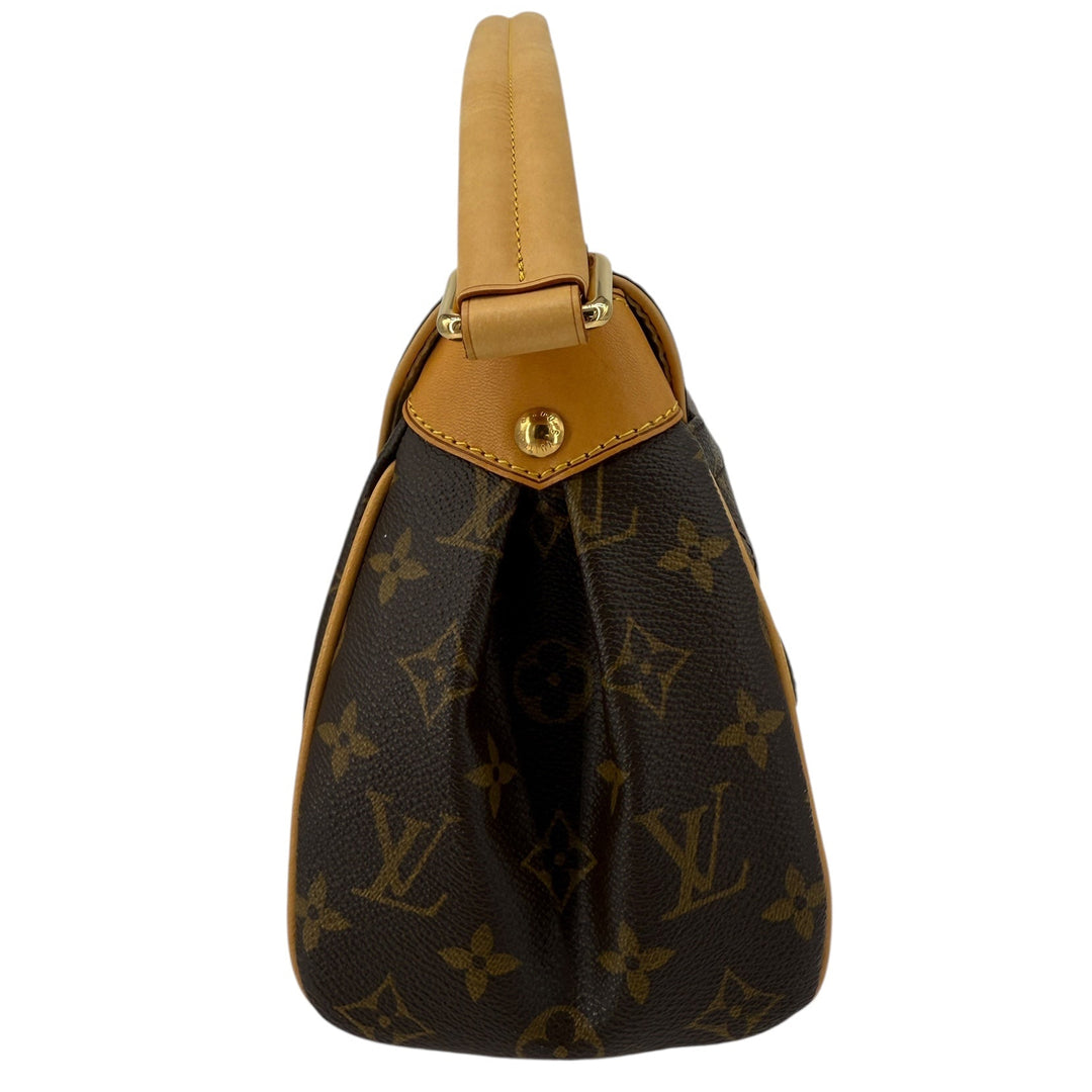 Side view of Louis Vuitton Monogram Beverly MM shoulder bag showcasing vachetta leather and polished brass hardware.