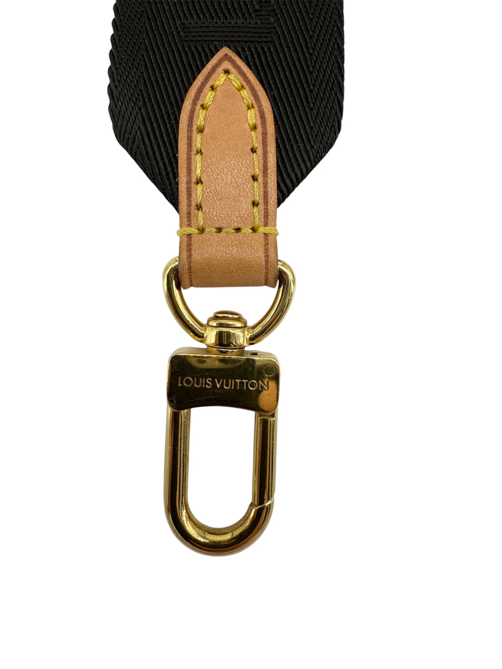 Close-up of Louis Vuitton Bandoulière bag strap clip featuring monogram canvas and gold hardware.