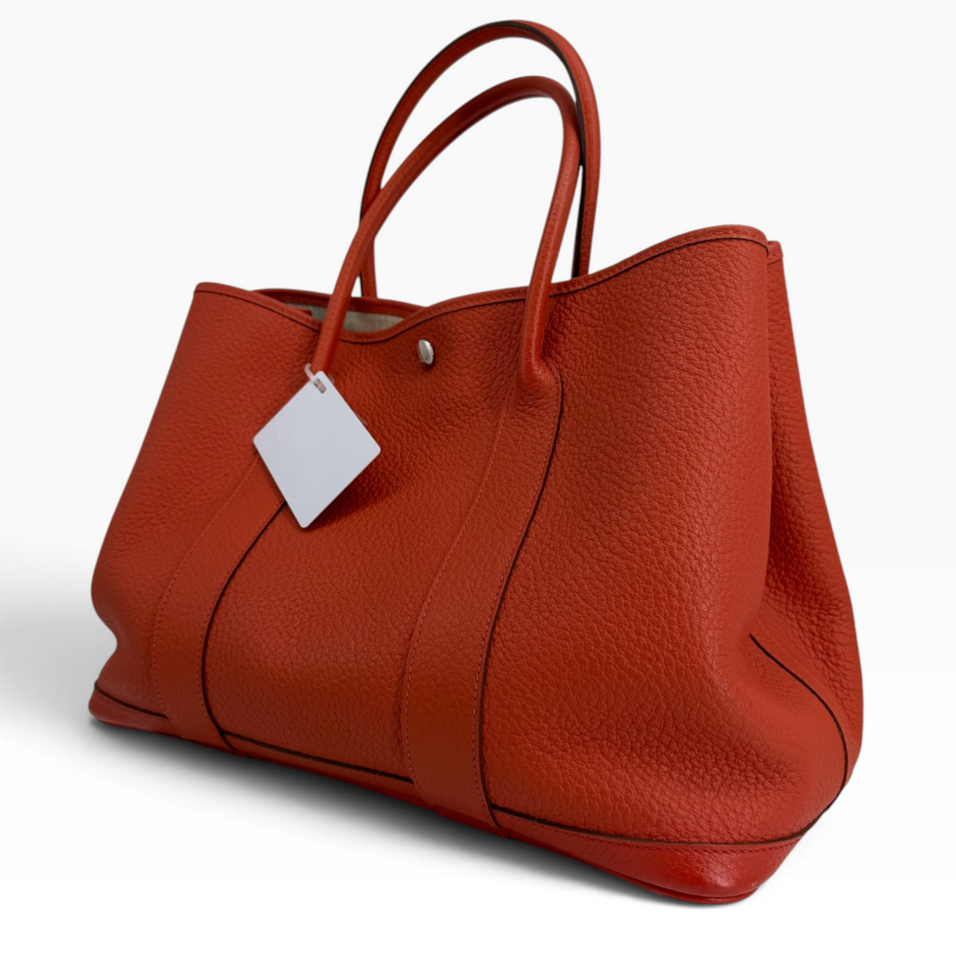 Hermès Garden Party 30 Orange Poppy side profile with expandable Negonda leather panels