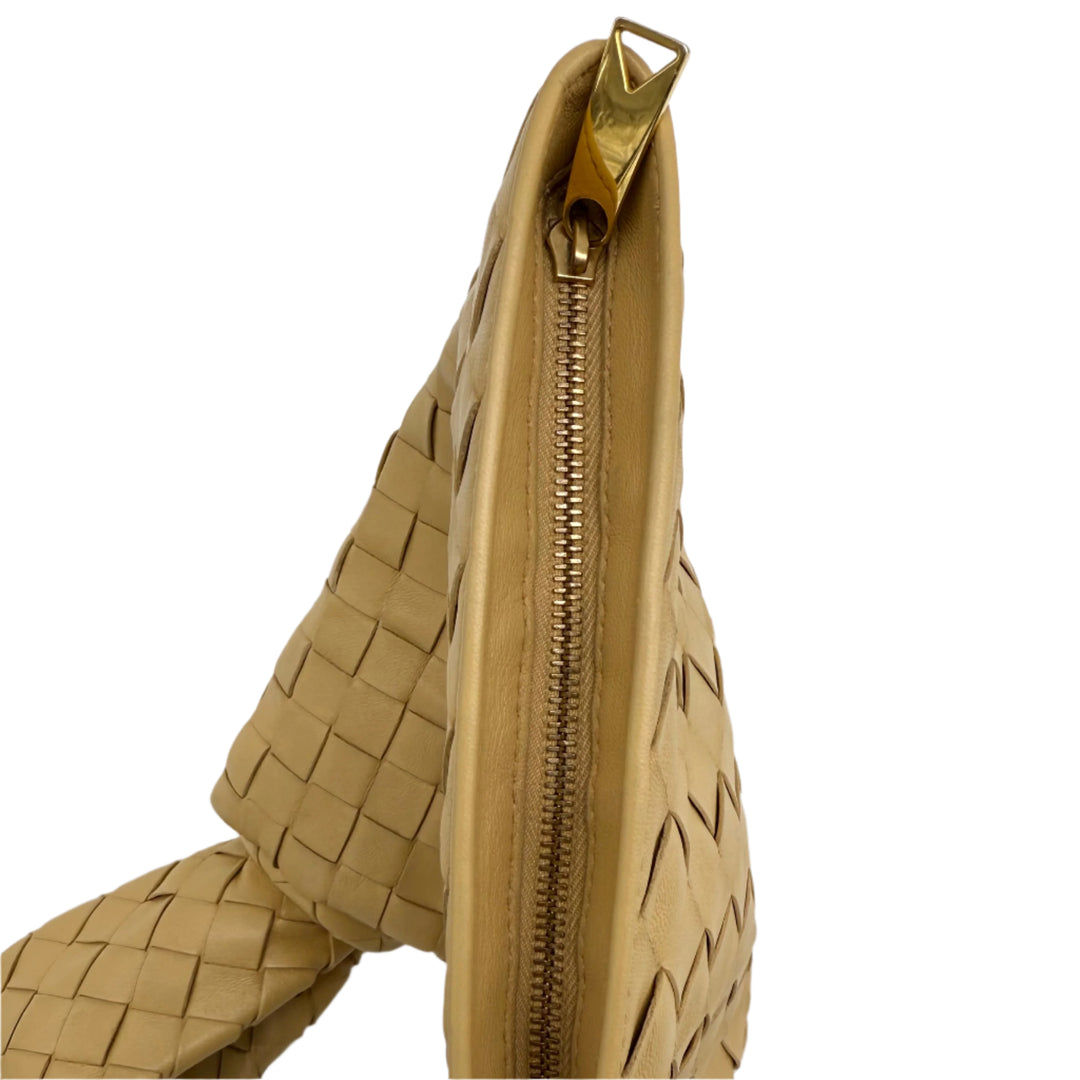 Bottega Veneta BV Twist Clutch in woven nappa leather with a gold zipper and architectural knotted detail.