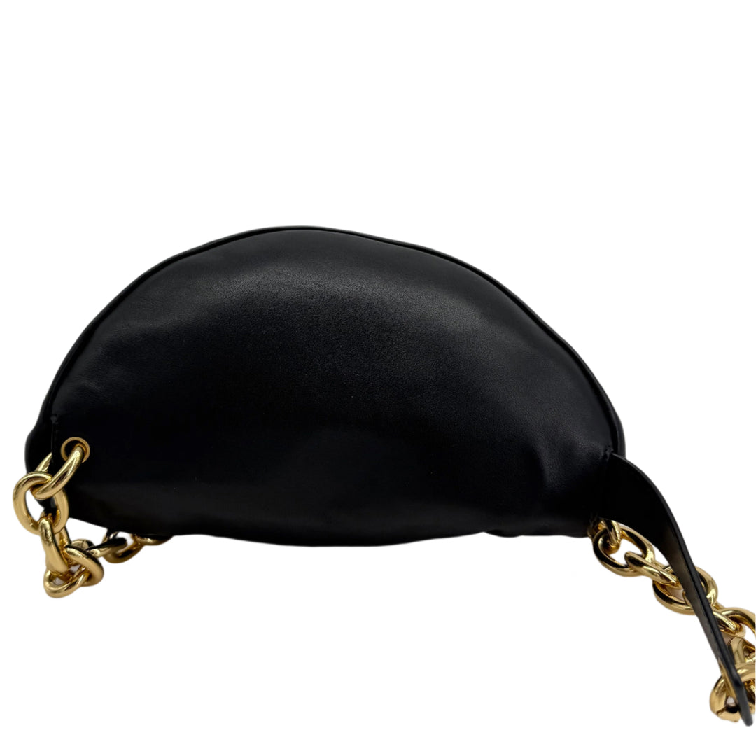 Bottega Veneta The Pouch Chain in black calfskin leather with gold chain strap, showcasing its unique silhouette.