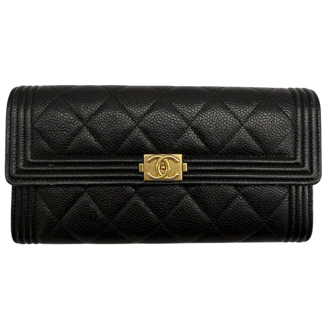 Chanel Caviar Quilted Large Boy Gusset Flap Wallet in black with signature CC clasp, showcasing luxury and functionality.