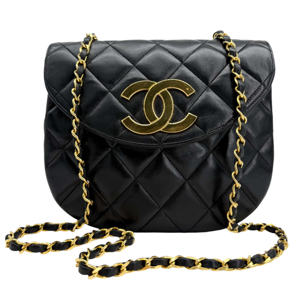 Chanel Lambskin Quilted Small Single Flap Bag in black with gold CC turn-lock and chain strap.