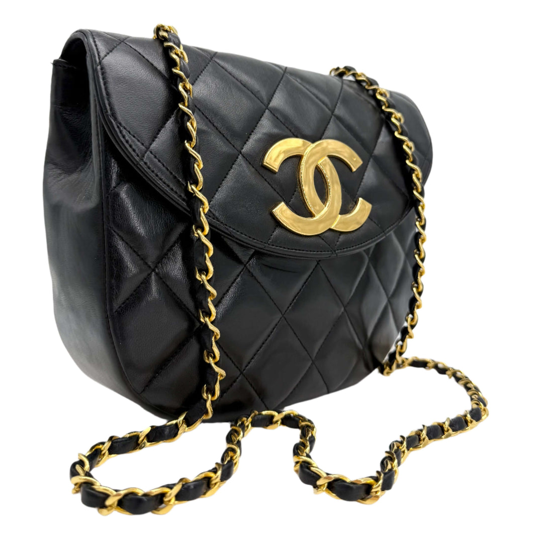 Chanel Lambskin Quilted Small Single Flap Bag in black with gold CC turn-lock and leather-threaded chain.