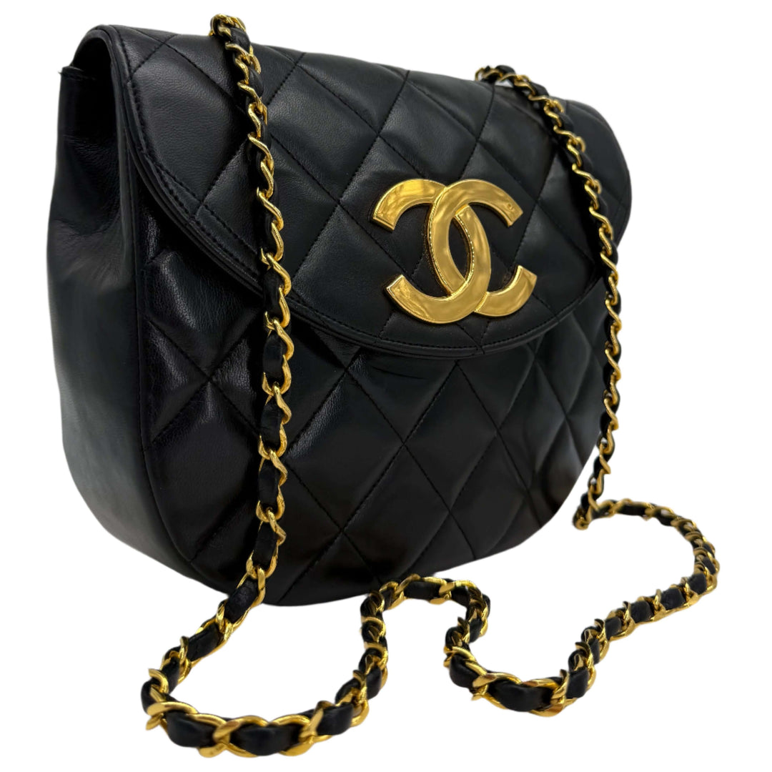 Chanel Lambskin Quilted Small Single Flap Bag in black with gold CC logo and chain strap.