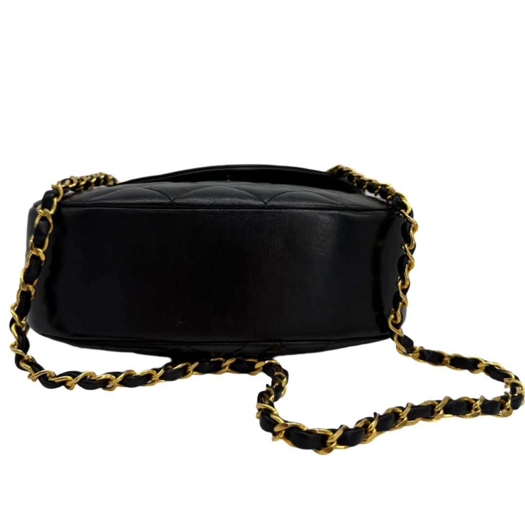 Chanel Lambskin Quilted Small Single Flap Bag in black, showcasing its gold chain and diamond-quilted design.