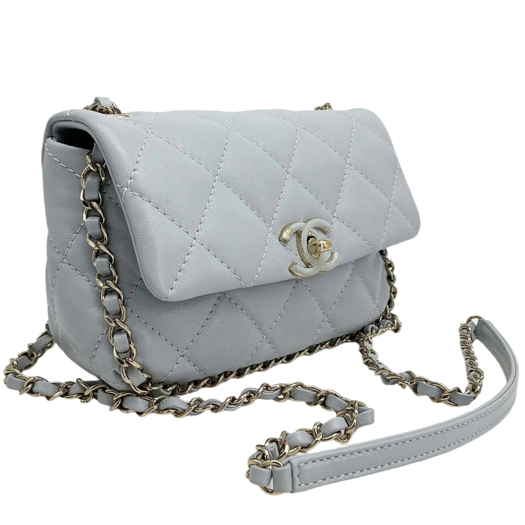 Chanel Mini Chain Around Flap Bag in quilted calfskin leather with chain strap, showcasing elegant design and luxury craftsmanship.