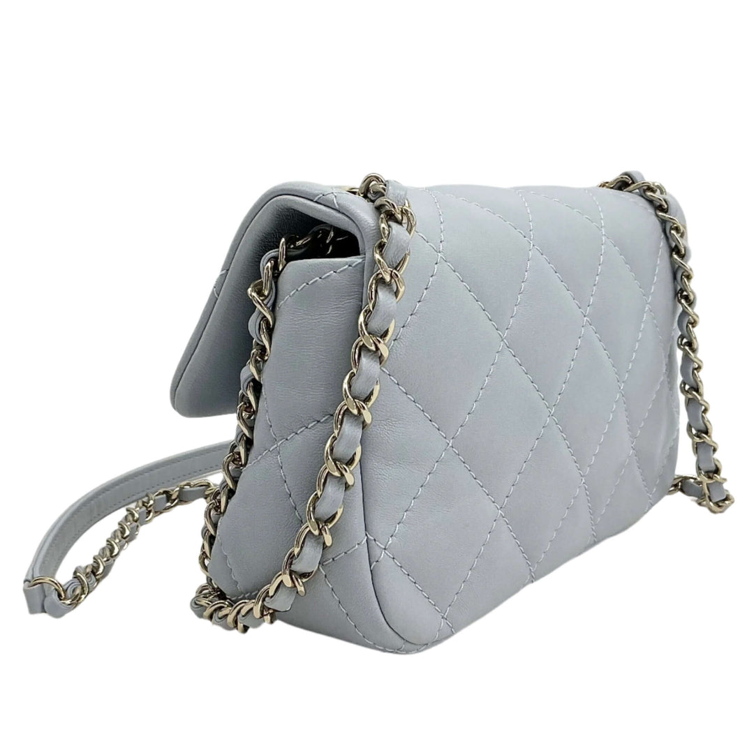Chanel Mini Chain Around Flap Bag in quilted calfskin leather with chain strap, showcasing elegance and modern design.