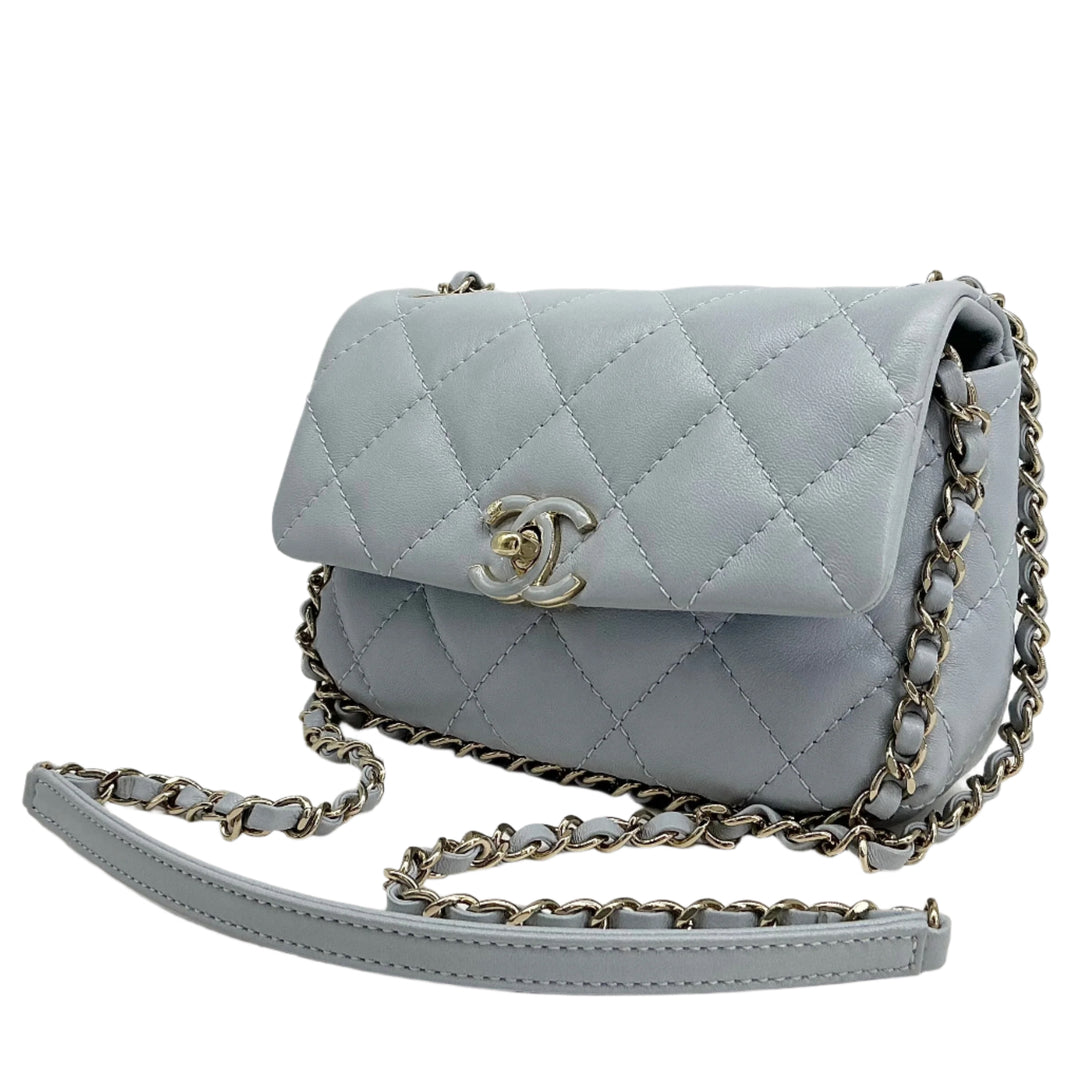 Chanel Mini Chain Around Flap Bag in quilted calfskin leather with crossbody strap and twist-lock CC closure.