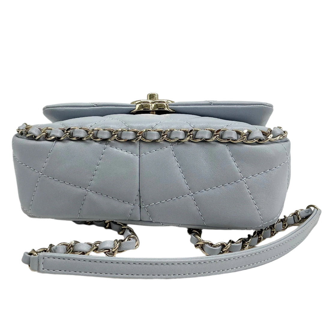 Chanel Mini Chain Around Flap Bag in quilted calfskin leather with signature gold chain strap and twist-lock closure.