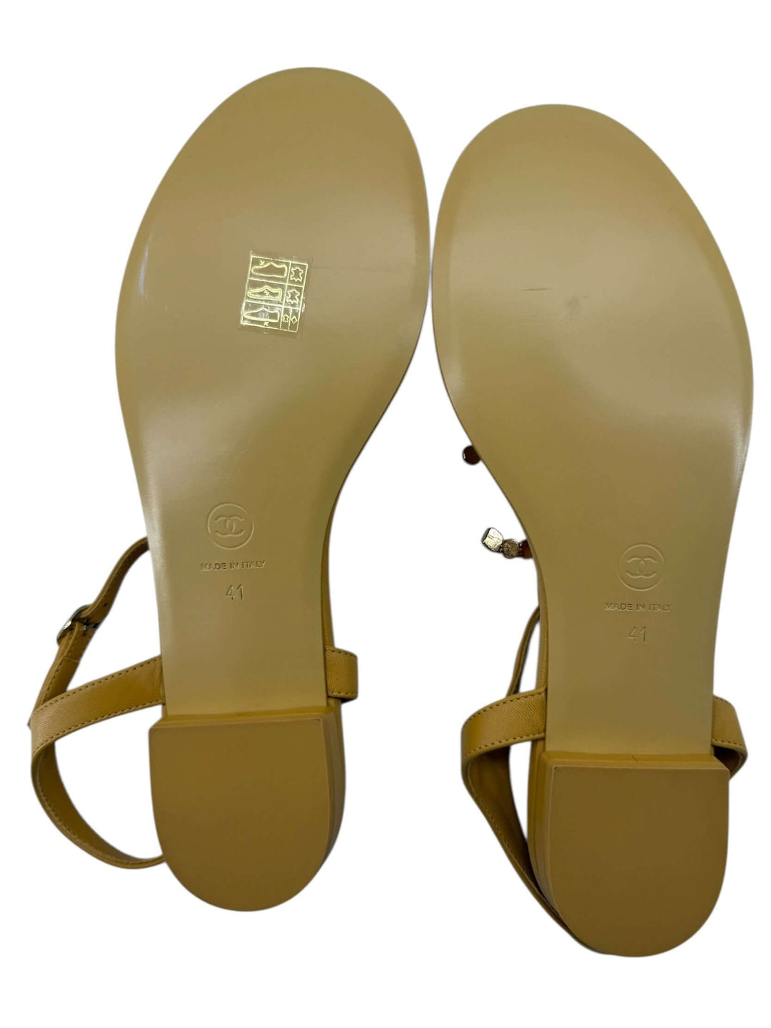 Bottom view of CHANEL Mustard Embellished Sandals – Size 41, showcasing the leather and signature logo.