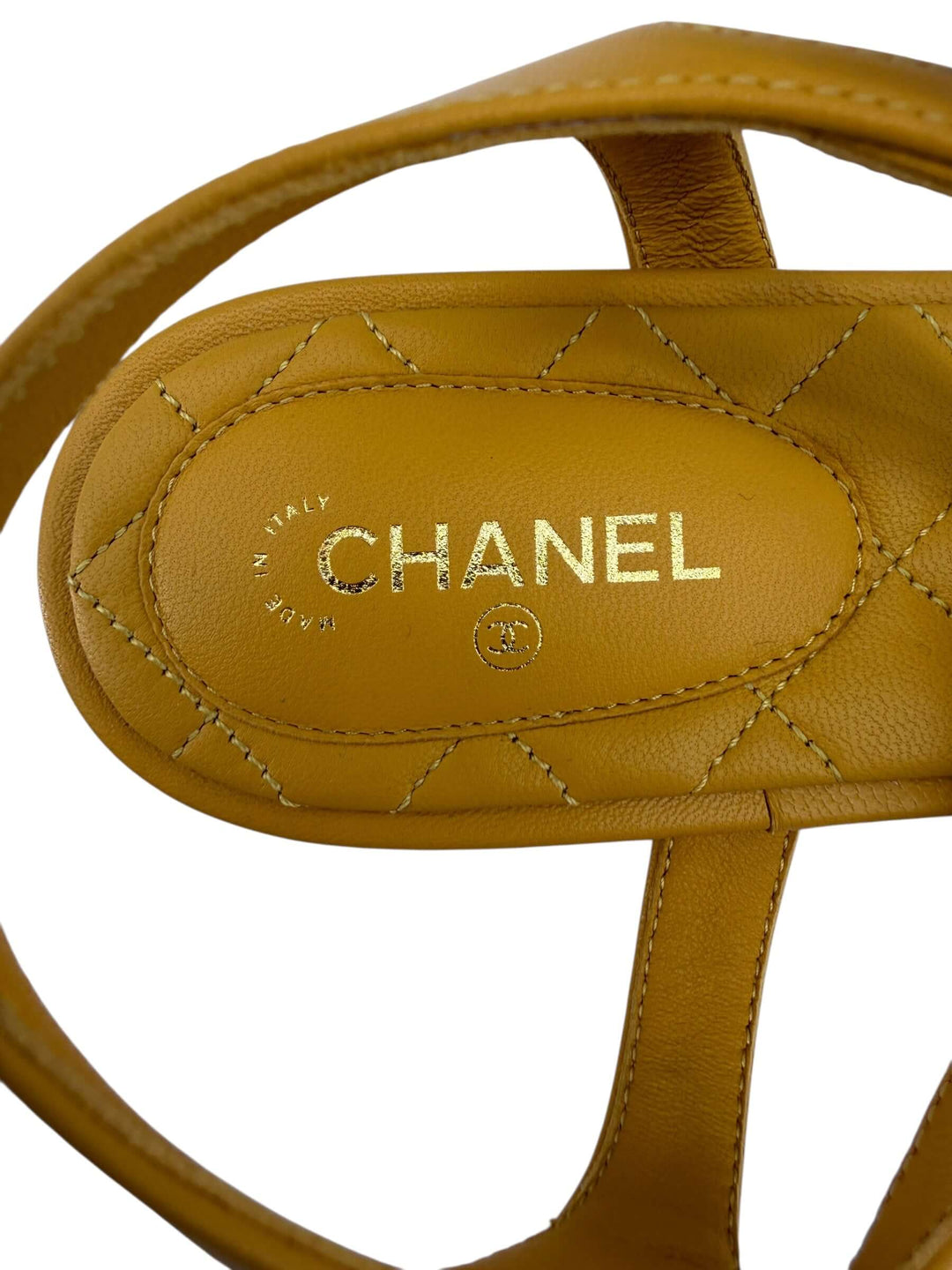 CHANEL Mustard Embellished Sandals – Size 41 view of the quilted footbed with CHANEL logo in gold.