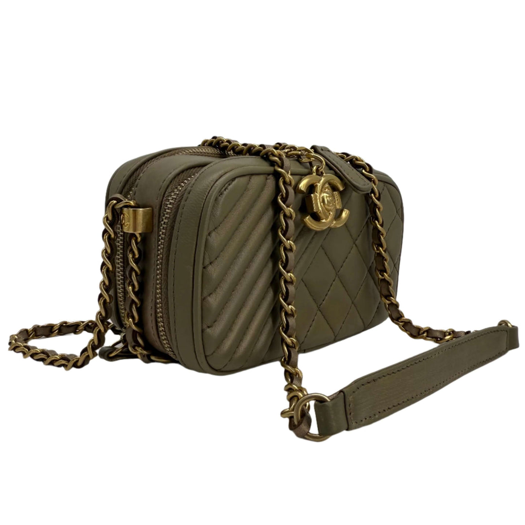 Chanel quilted olive green leather crossbody bag with antique gold chain and signature logo.