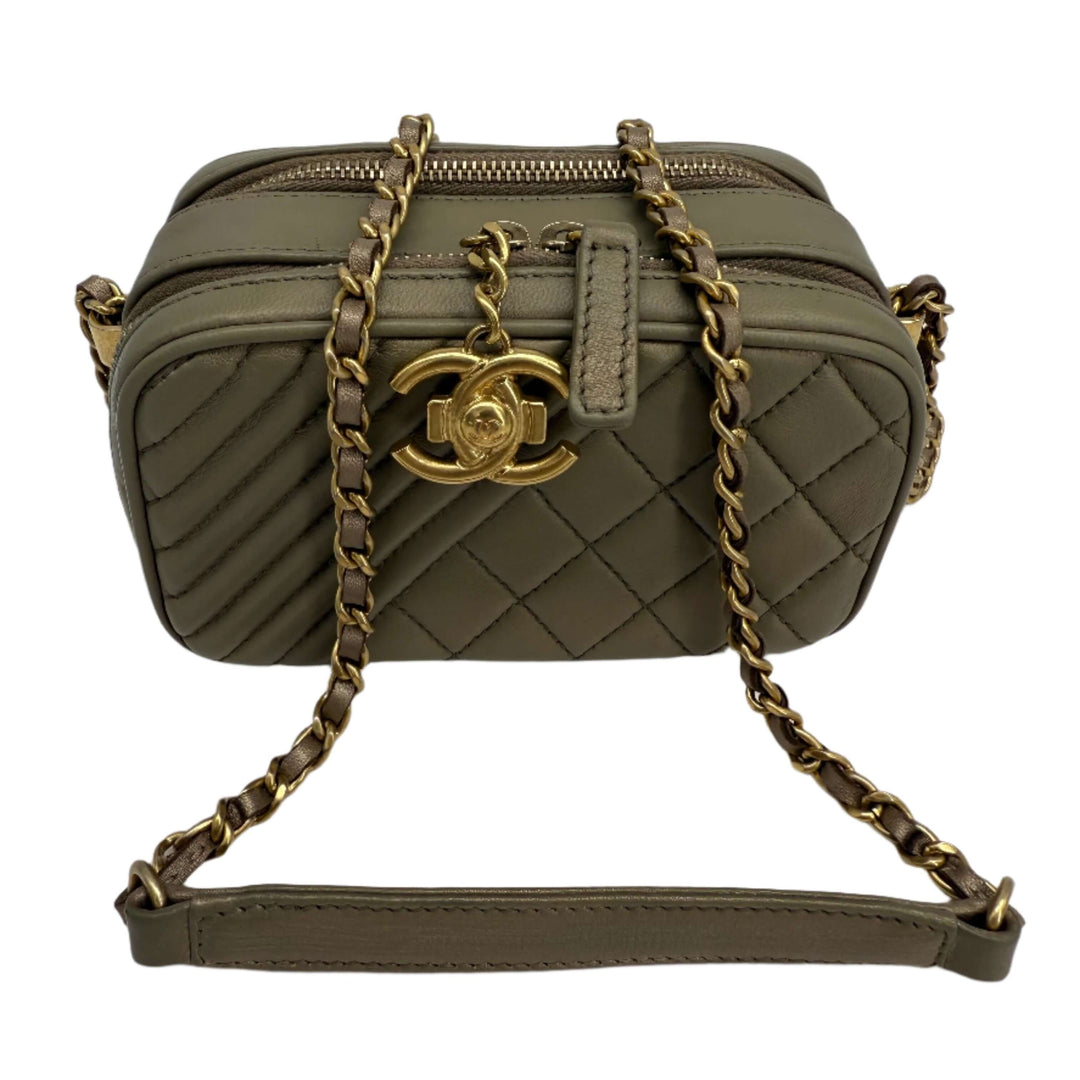 Chic olive green quilted Chanel handbag with gold-tone hardware and chain strap for versatile wear.