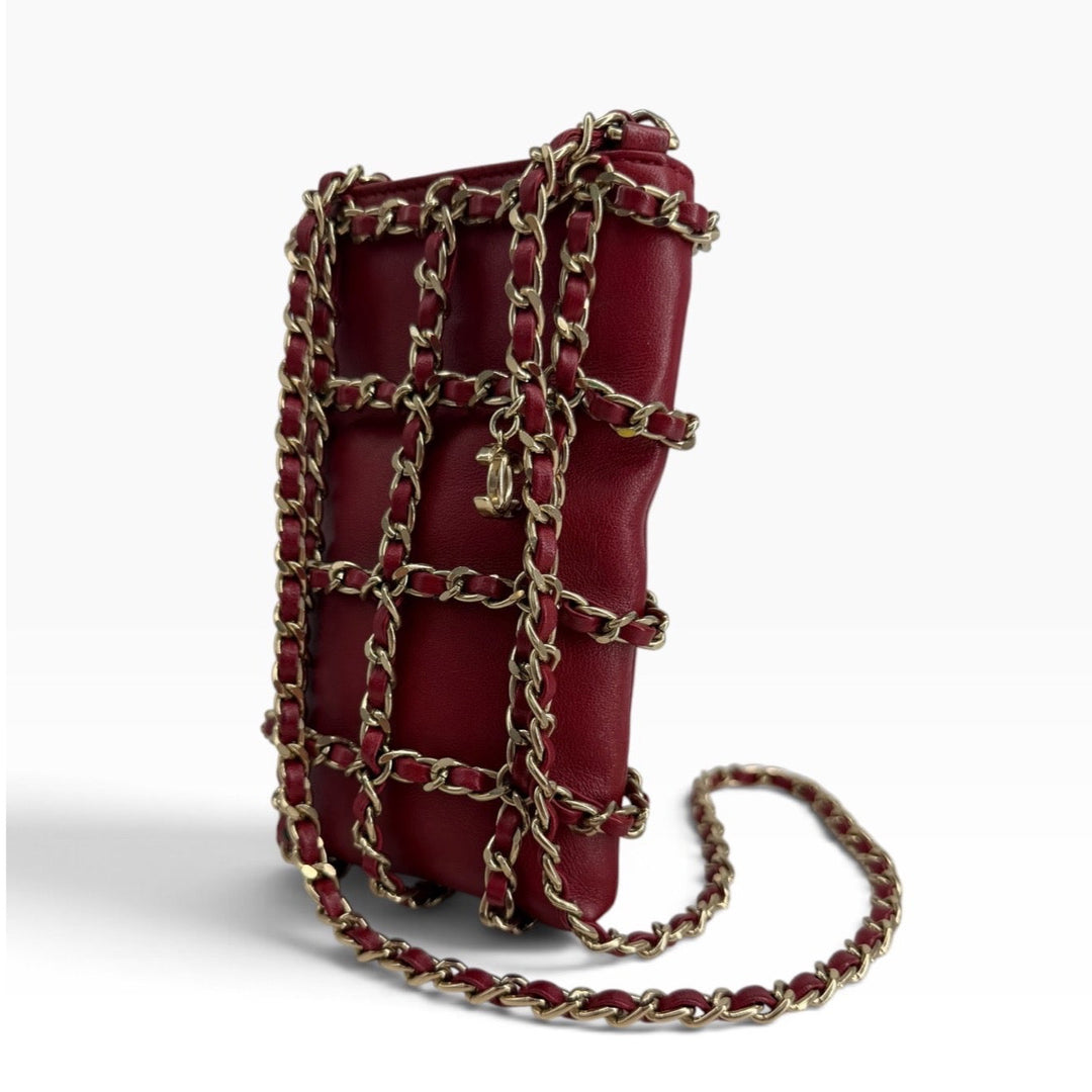 Chanel red lambskin phone holder side view with chain strap