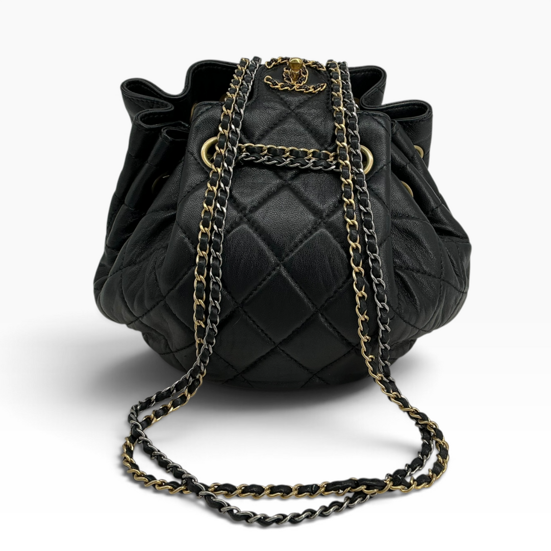 Chanel Small 19 Bucket Bag black shown worn on shoulder for size and scale