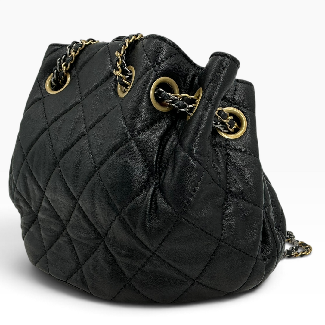Chanel Small 19 Bucket Bag black angled view showing quilted calfskin and gold-tone chain hardware