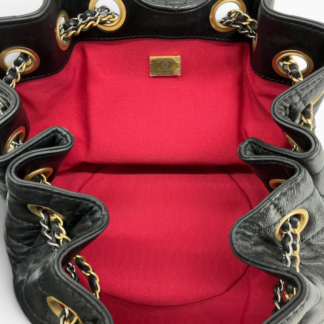 Chanel Small 19 Bucket Bag interior showing contrasting red grosgrain lining and interior organization