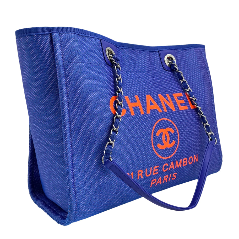 Chanel Small Deauville Tote in blue and orange canvas with chain handles and logo.