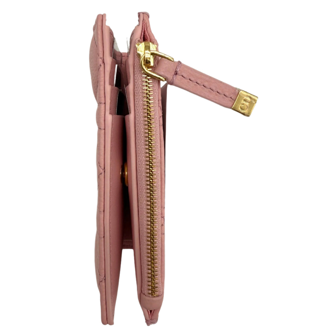 Christian Dior Cannage Caro Slim Wallet in Glycine Pink, showcasing calfskin leather with gold hardware in a sleek profile.