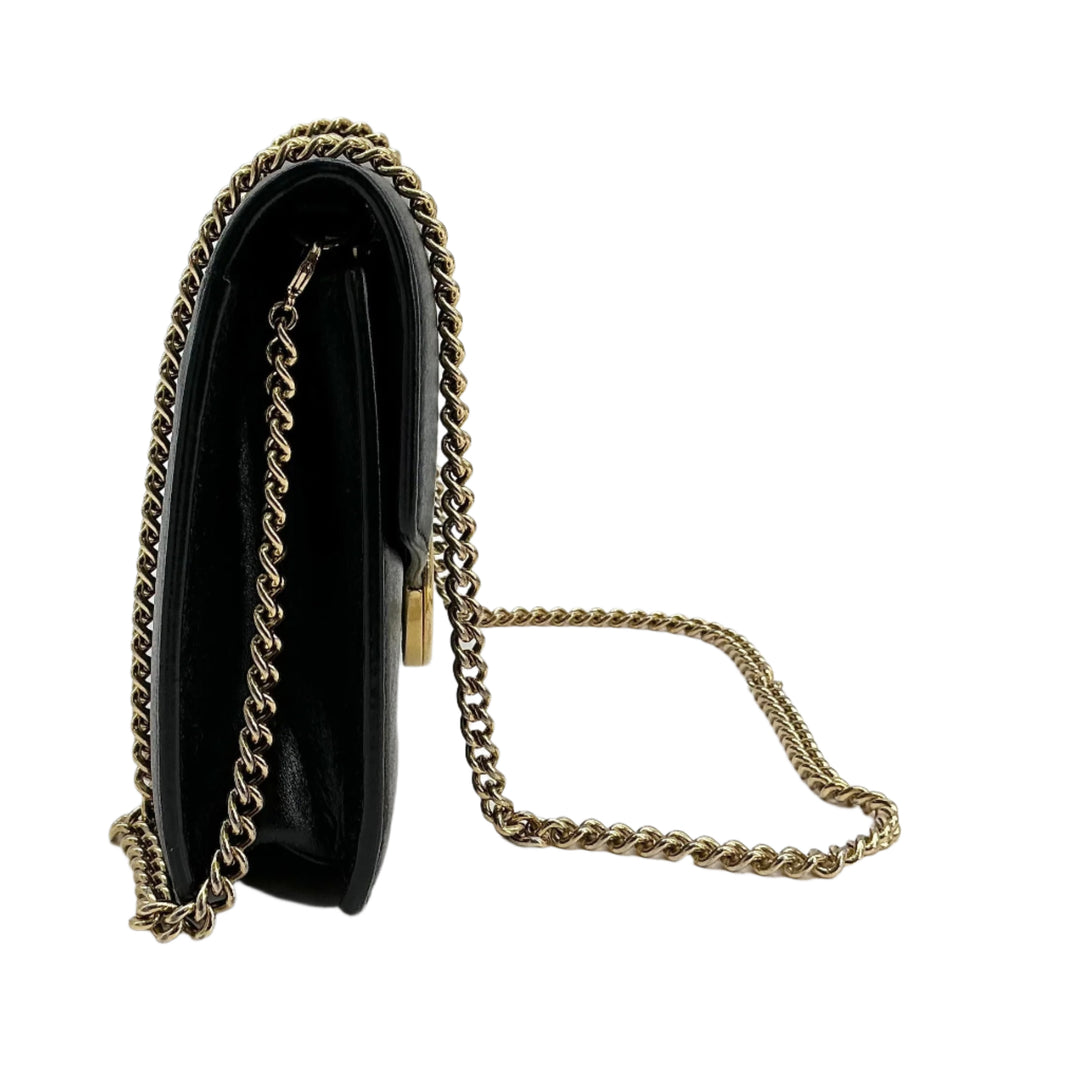 Side view of Fendi Medium Envelope Wallet on Chain in black leather with gold-tone chain strap.