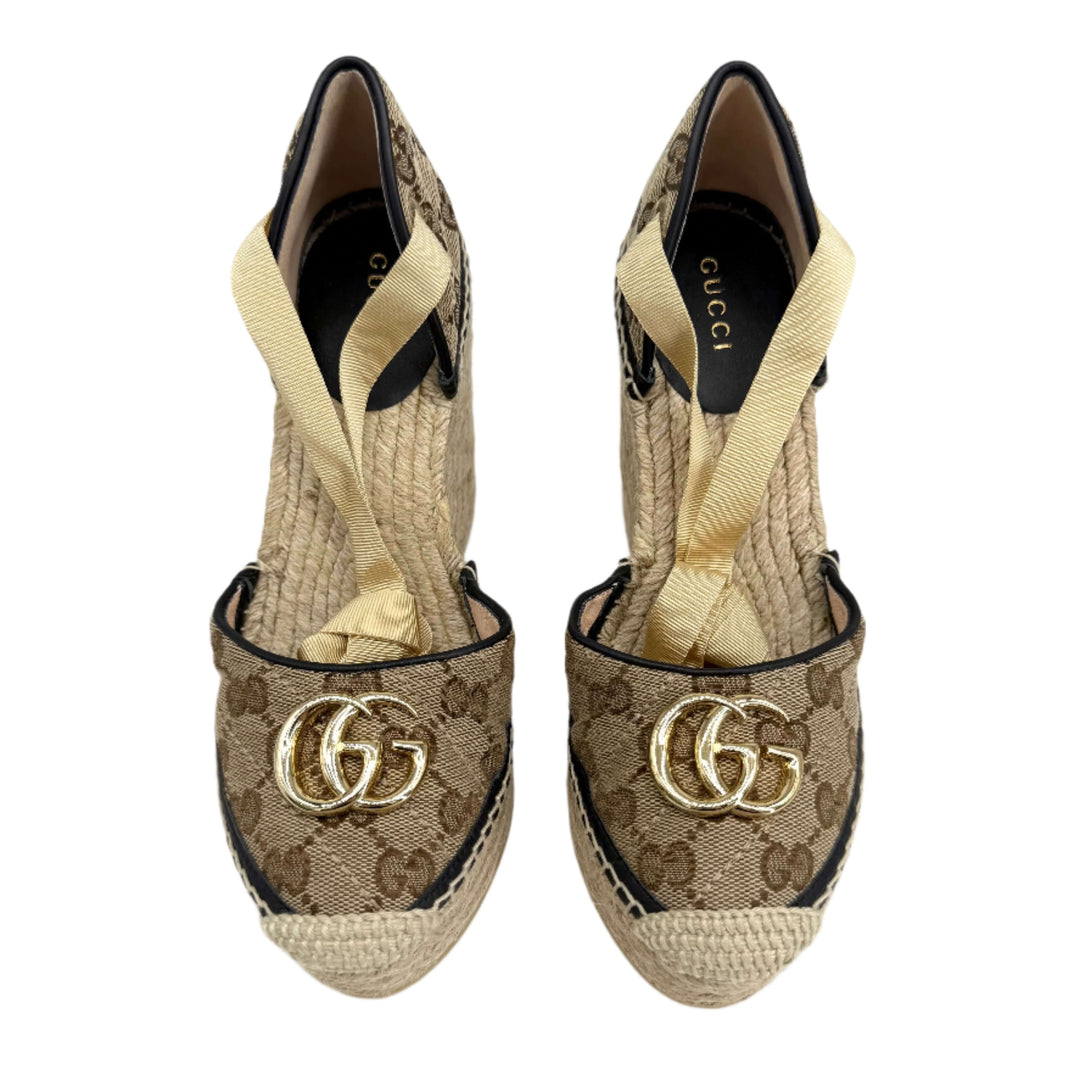 Gucci GG Marmont monogram espadrille wedges in beige and ebony with jute wedge and gold logo detailing.