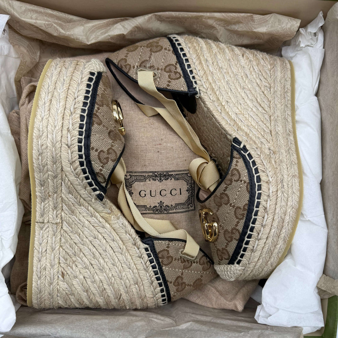 Gucci GG Marmont Monogram Matelassé Espadrille Wedges in beige and ebony, showcasing woven jute and elegant trim.