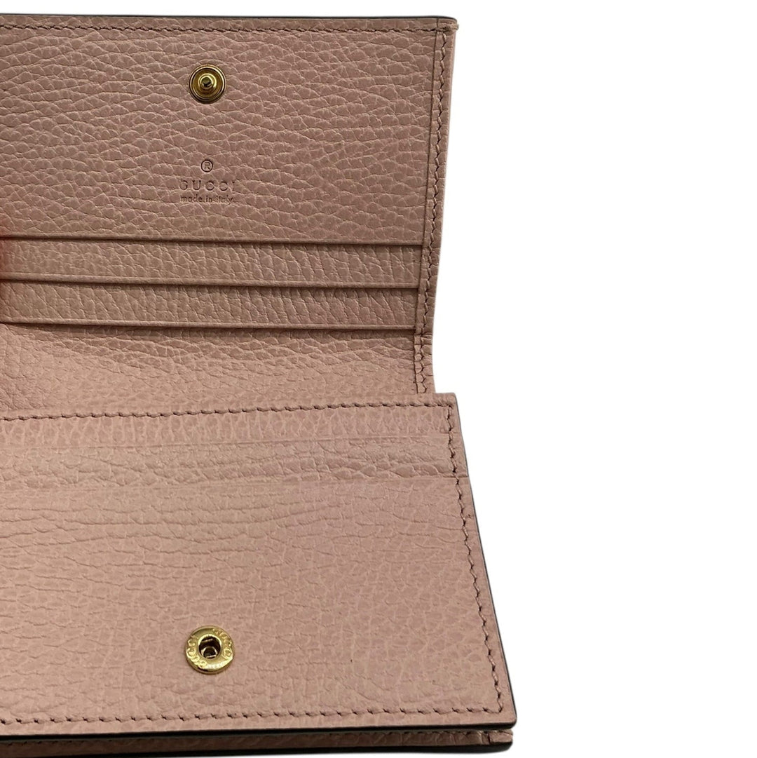 Gucci GG Marmont pink leather wallet interior with card slots and snap closure